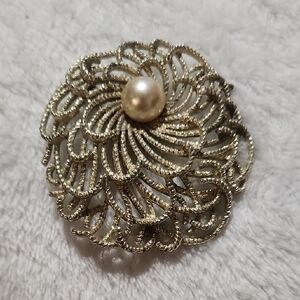 Intricate Gold Brooch with Pearl Center
